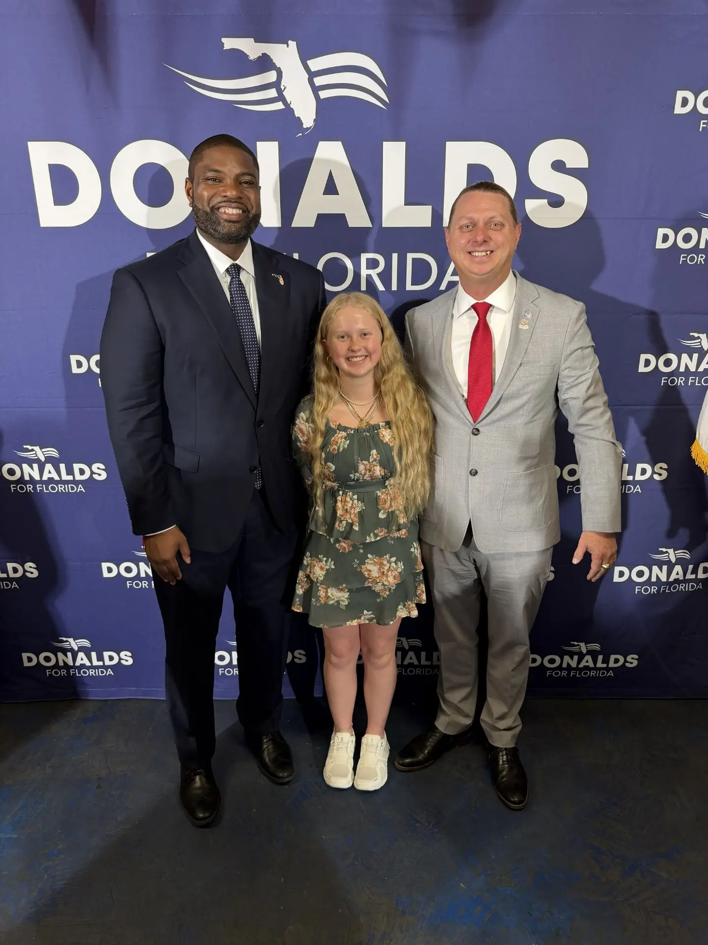 Byron Donalds with Larry Bell and his daughter Zoë Bell at VFW Post 10094 in Largo, Florida