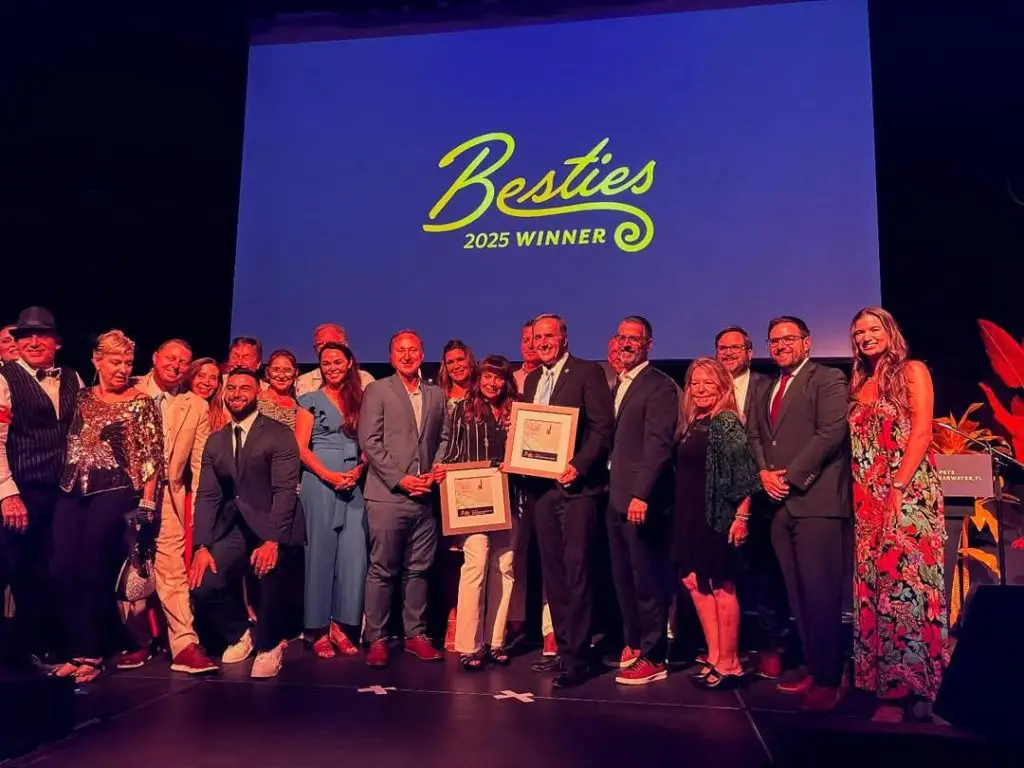 Larry Bell with Clearwater Beach Collection representatives at the 2025 Besties Awards
